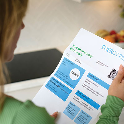 Person reviewing a high energy bill